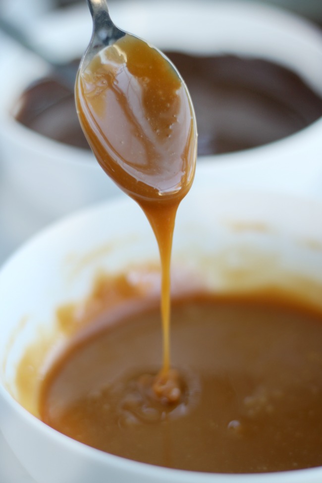 melted caramel pouring off spoon