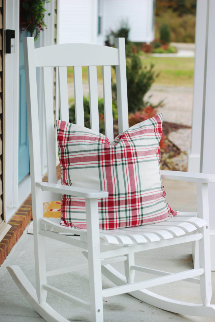 holiday throw pillow on front porch