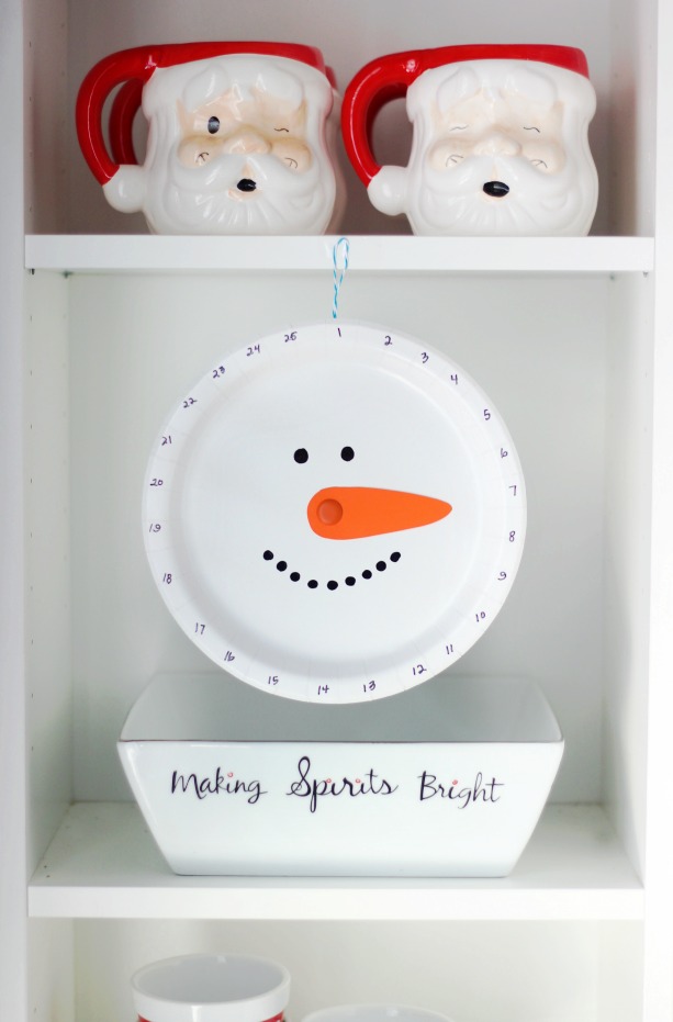 snowman christmas countdown hanging on shelf