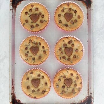 giant chocolate chip cookies on baking sheet