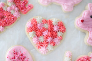 heart sugar cookie decorated with star frosting tip