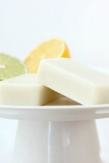 Lotion bars on a white pedastal platter.