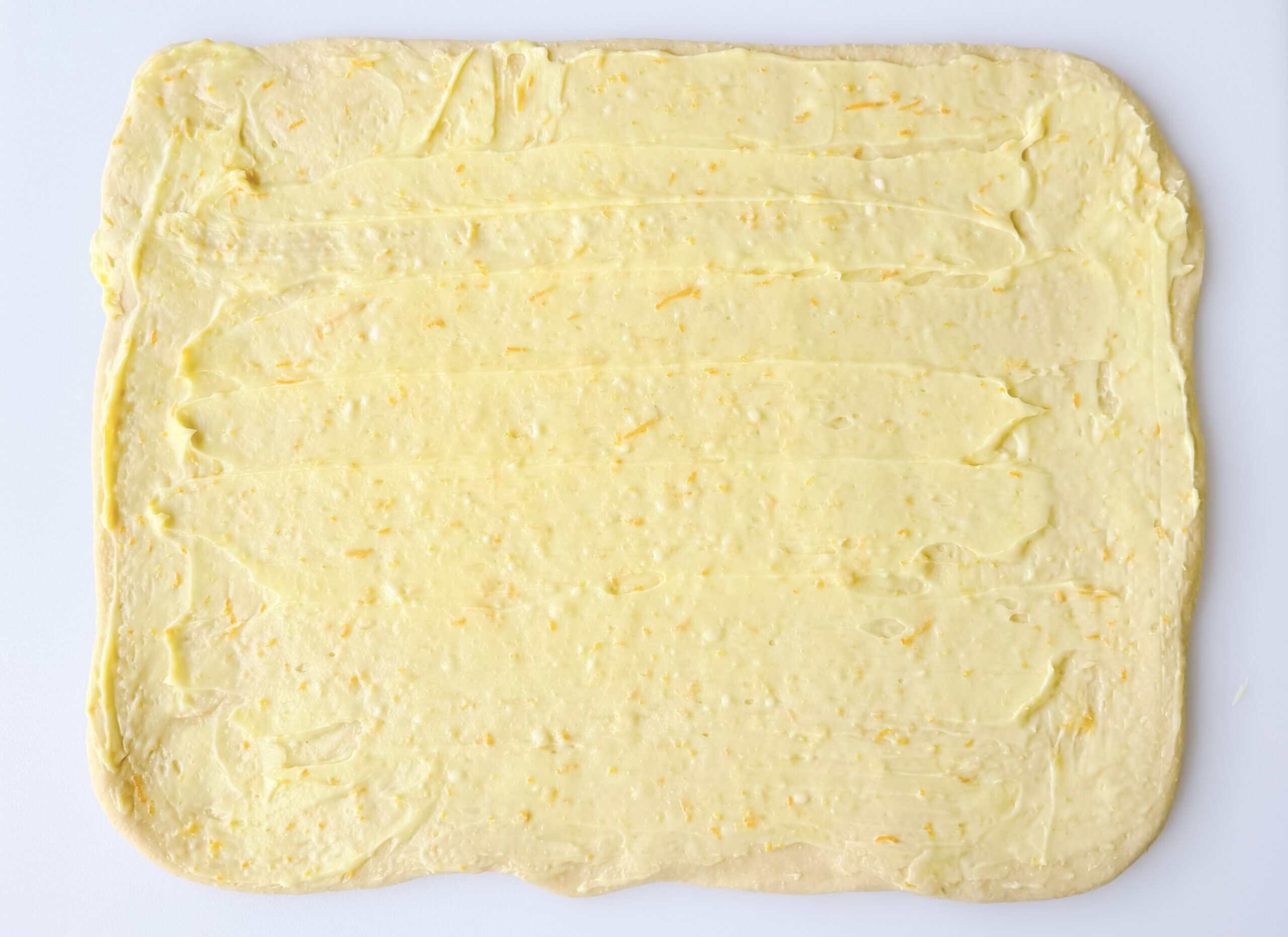 Sweet roll dough rolled into large rectangle and spread with filling.