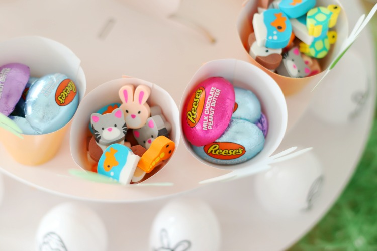 paper treat cups with chocolate candy and erasers