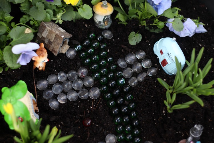 fairy garden path made from marbles