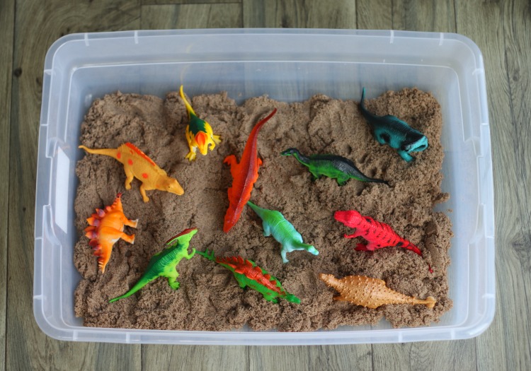 mini dinosaur toys in kinetic sand