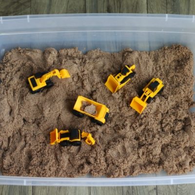 construction toys in sandbox
