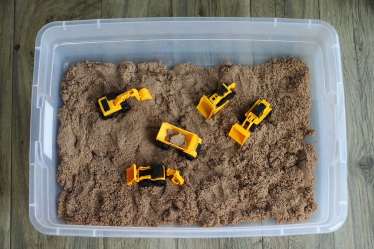 construction toys in sandbox