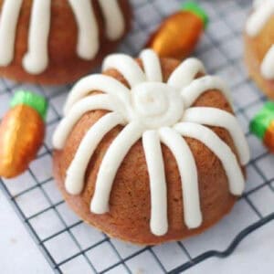 Mini carrot bundt cakes on wire cooling rack.