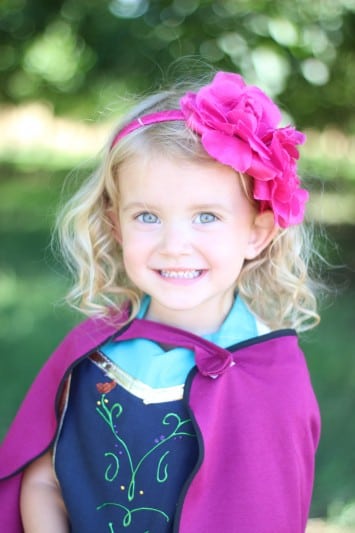little girl wearing anna apron