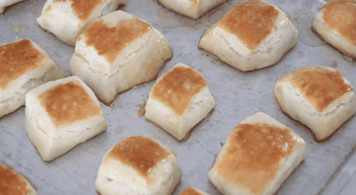 Baked pretzel bites on pan.