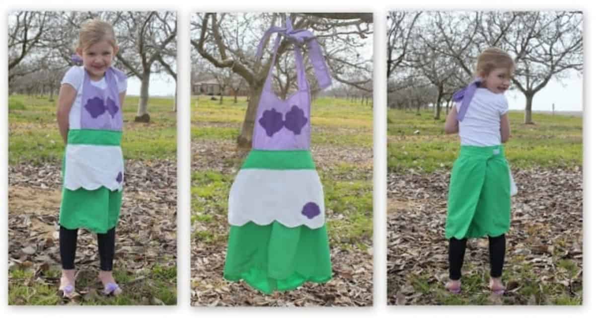 Little girl wearing Ariel princess apron.