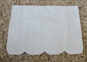white fabric with scalloped edge