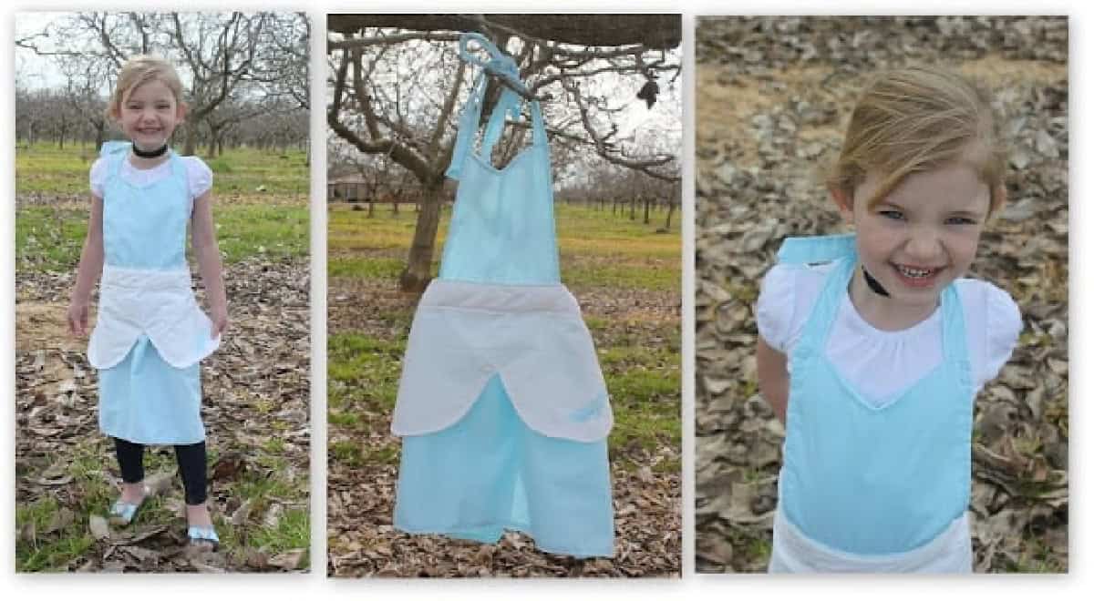 Little girl wearing Cinderella ball gown apron.