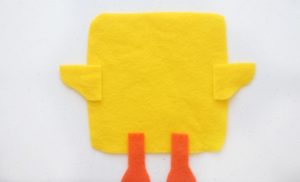 wings and feet on yellow felt square