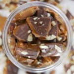 Jar of classic engligh toffee with almonds.