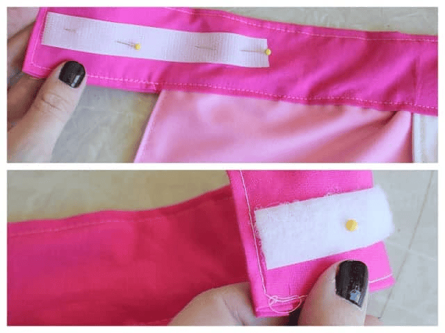 Velcro pinned to apron waistband.