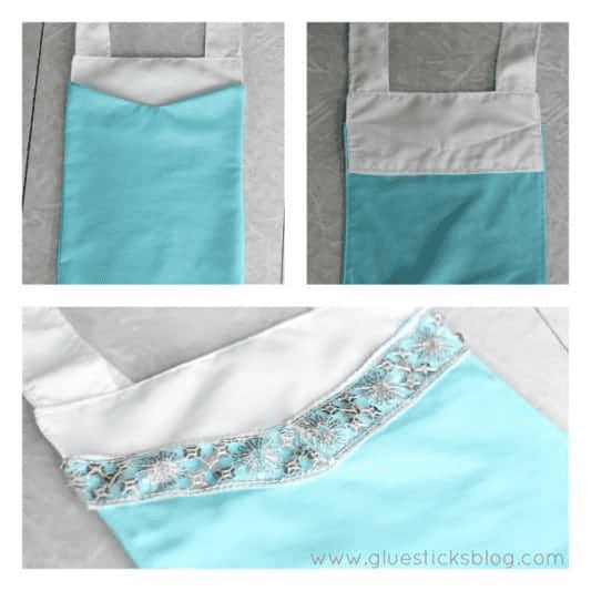 Blue and white apron front with lace sewn as decoration.