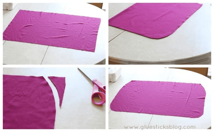 Purple fabric with corners rounded.