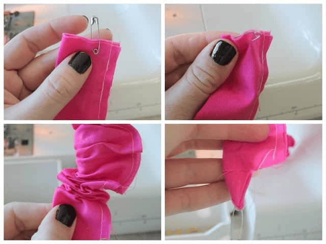 Pink strap sewn along side seam, turned right side out with saftey pin.