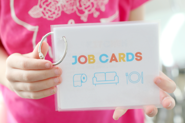 child holding job cards