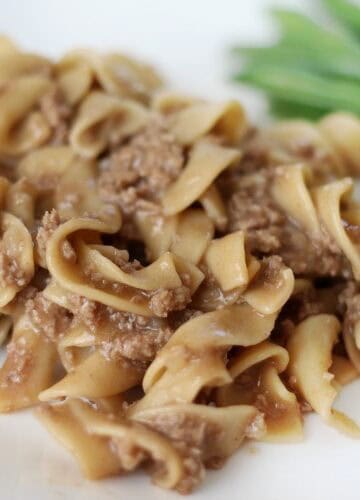 quick and easy stroganoff with green beans on plate