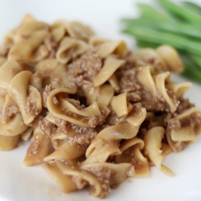 quick and easy stroganoff with green beans on plate
