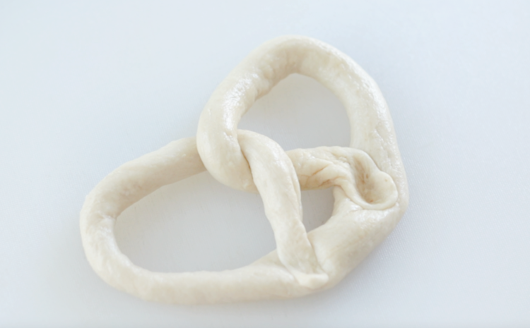 pretzel dough twisted into pretzel shape