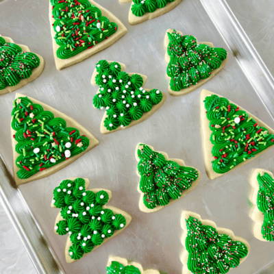 baking sheet of green christmas tree sugar cookies