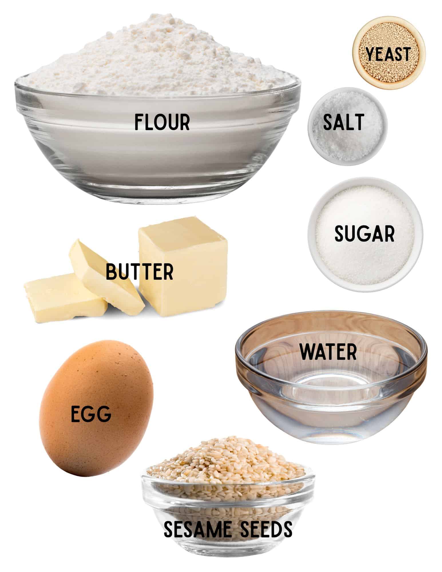 Bowls of flour, salt, yeast, sugar, water, sesame seeds, an egg and slices of butter.