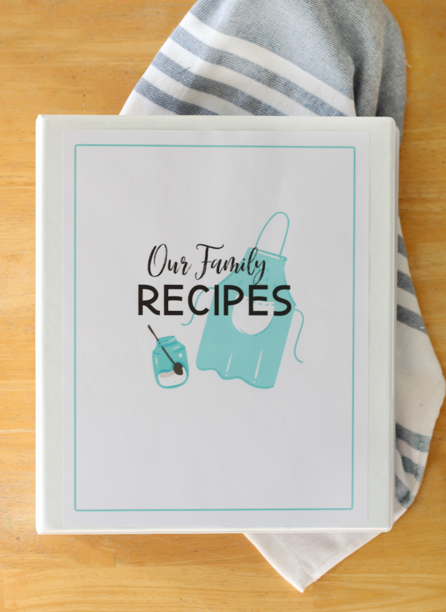 family recipe cookbook on table next to hand towel