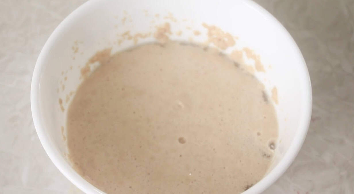 Bowl of yeast, water and sugar proofing.