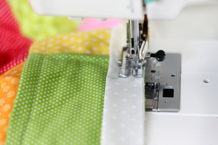 sewing machine stitching quilt binding