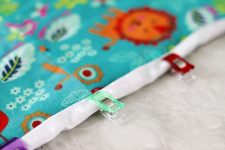 sewing clips clipped onto quilt binding