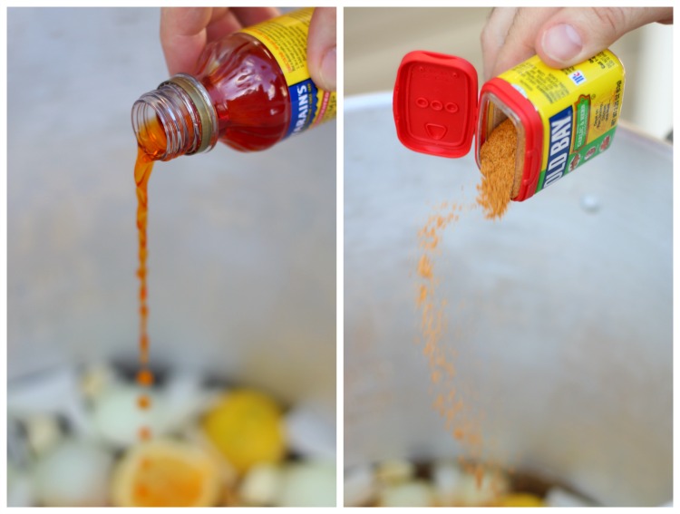 old bay seasoning and crab boil seasoning poured into pot