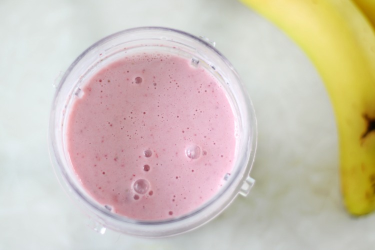 strawberry protein smoothie in blender cup