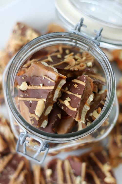 toffee broken into bite sized pieces in clear glass jar
