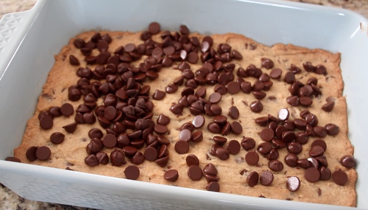 baked toffee bars with chocolate chips sprinkled across