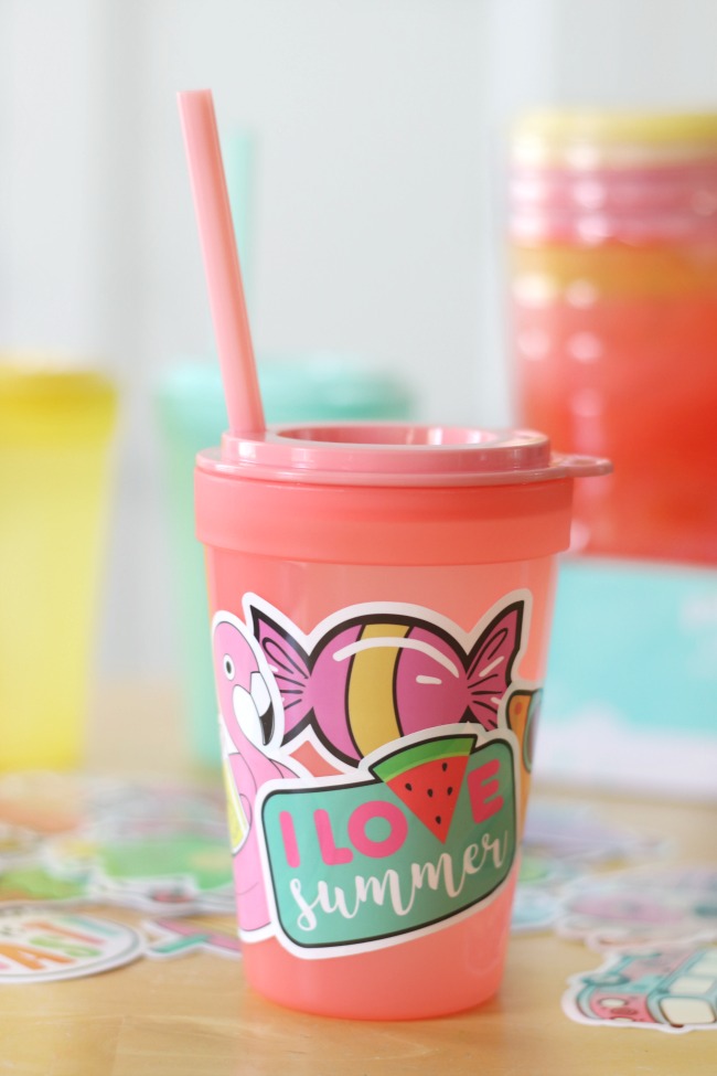 pink tumbler decorated with stickers