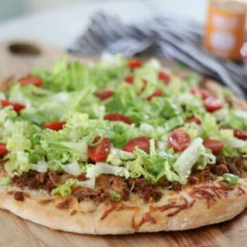 taco pizza on cutting board