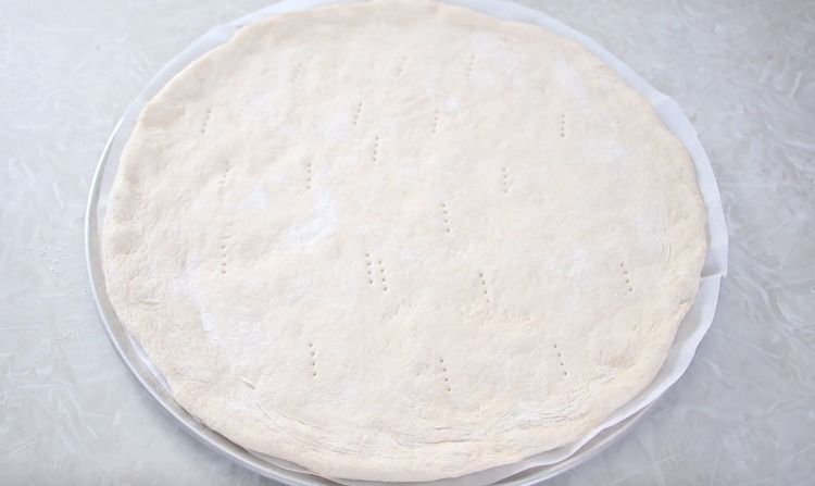 rolled out pizza dough