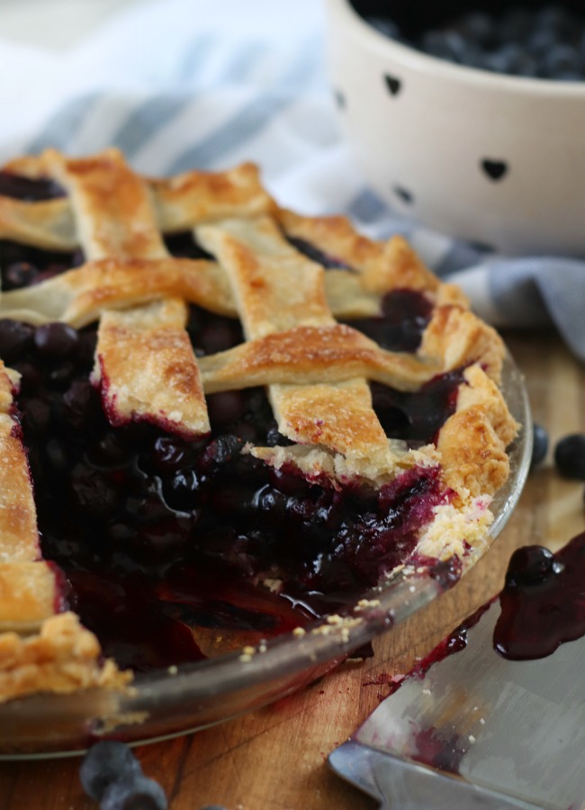 blueberry pie with slice cut out