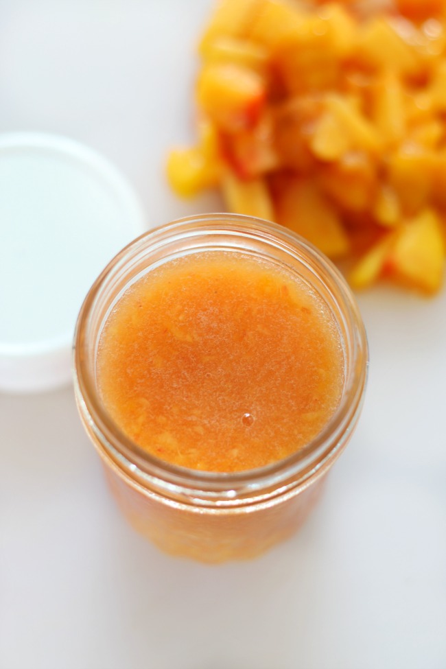 open jar of peach freezer jam
