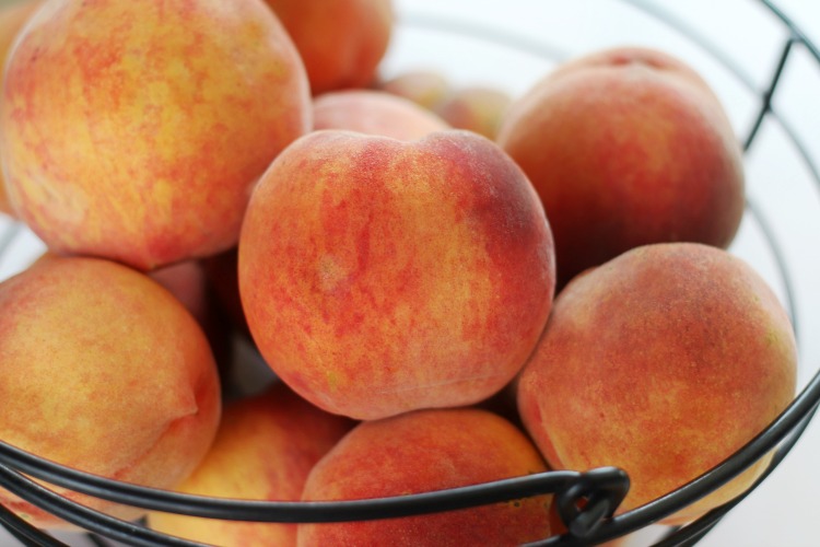 basket of fresh peaches