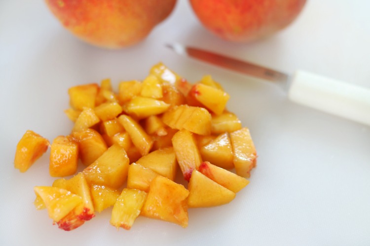 diced peaches on cutting board