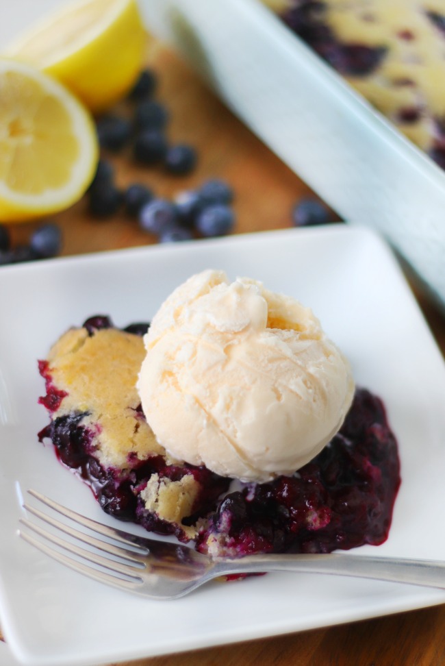 serving of blueberry cobbler with a scoop of vanilla ice cream on top