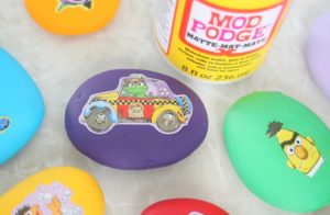 rocks painted with acrylic paint and sesame street stickers added