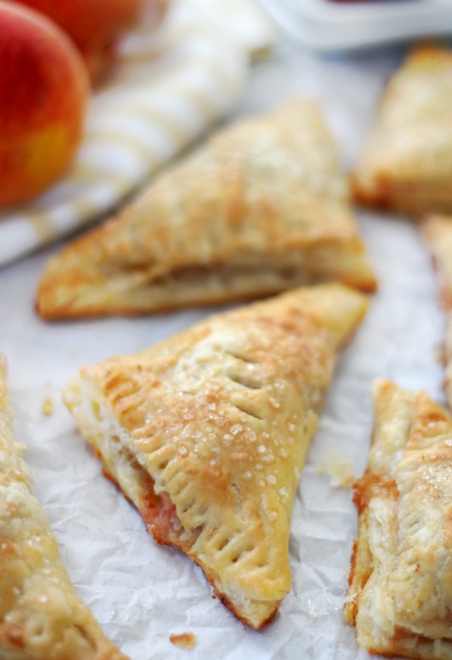 baked peach turnovers on baking sheet