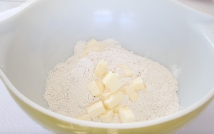 mixing bowl with flour and cubes of butter