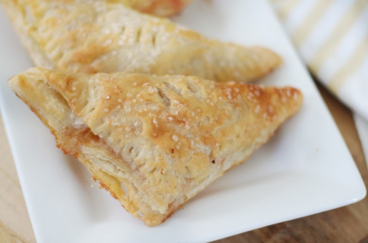 peach turnovers on white serving plate